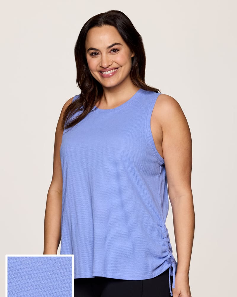 Side of a model wearing a size 2X Plus Day Dreamer Ruched Tank in Periwinkle by RBX Active. | dia_product_style_image_id:341690